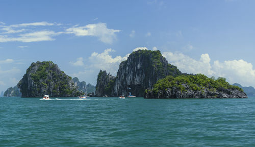 Scenic view of sea and rock formation against sky