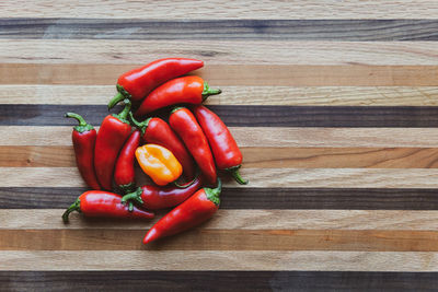 High angle view of red chili peppers on table