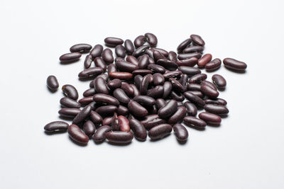 Close-up of coffee beans against white background