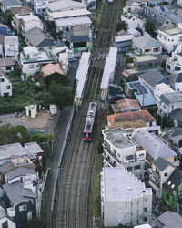 High angle view of railroad track amidst buildings in city