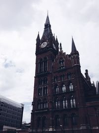 Low angle view of clock tower against sky