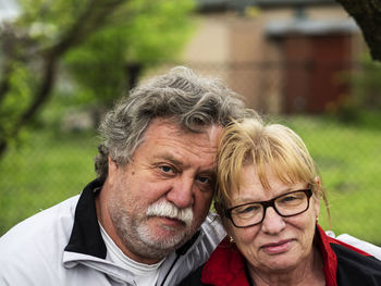 Close-up portrait of couple in park