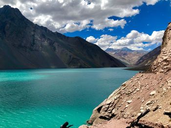 Scenic view of sea and mountains against sky