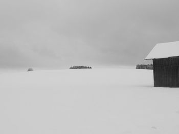 Scenic view of snow covered landscape against sky