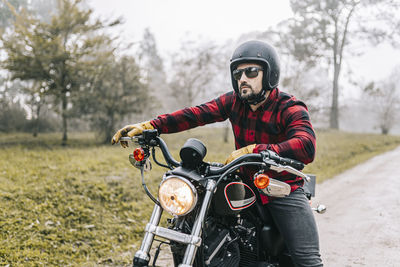 Young man riding motorcycle