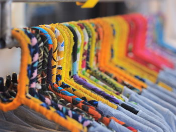 Close-up of multi colored pencils in store,hangers in shop