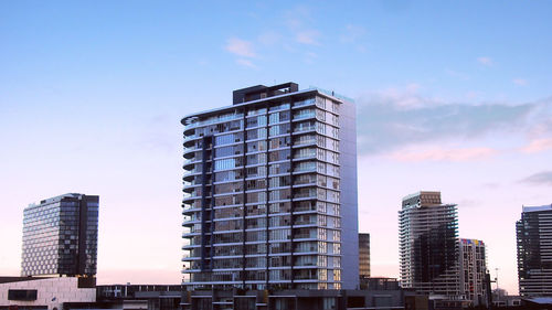 Low angle view of skyscrapers against sky