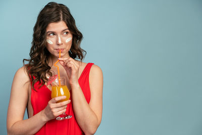 Portrait of a woman drinking glass