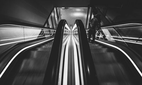 High angle view of man on escalator at subway station