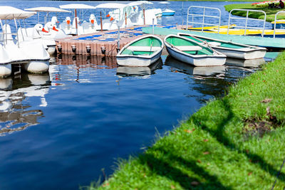 Boats moored in lake