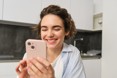 Young woman using mobile phone