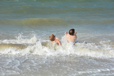 People enjoying in sea