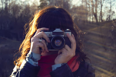 Woman photographing through camera