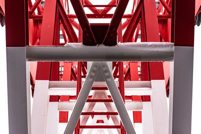 Pylon, red and white painted steel tower, showing the details of construction, joins, rivets.