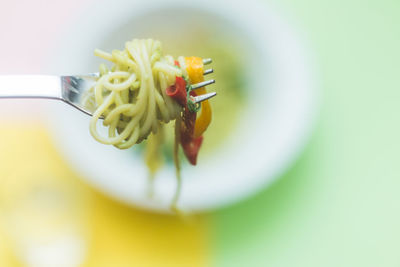 Close-up of fresh spaghetti on fork