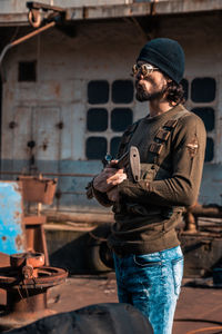 Young man standing outdoors