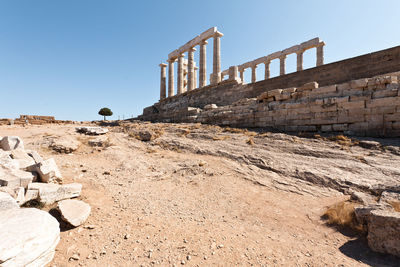 Low angle view of old ruins against clear sky