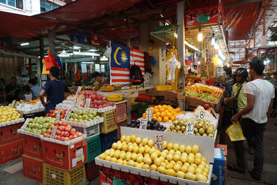Various fruits for sale at market stall