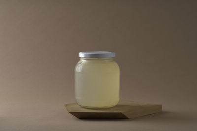 Close-up of glass of jar on table