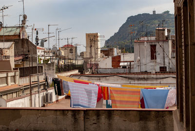 Buildings in town against sky