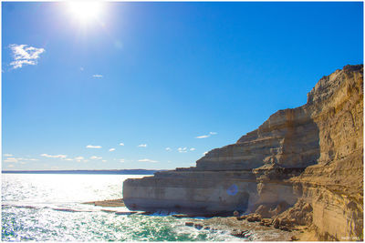 View of beach against blue sky