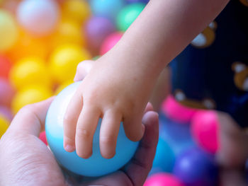 Close-up of hands holding baby hand