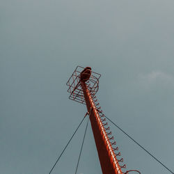 Low angle view of telephone pole against sky