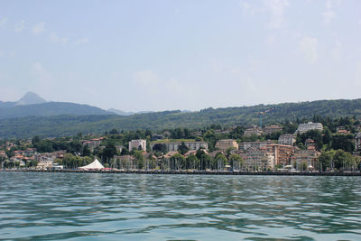 View of houses and mountains against sky