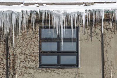 Icicles hang from rain gutters on a chilly winter day