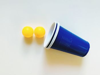 High angle view of yellow glasses on table