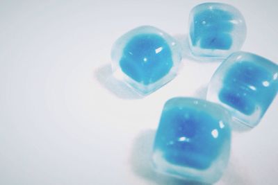 Close-up of multi colored object over white background