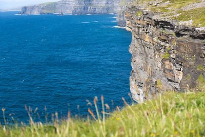 Scenic view of sea against blue sky