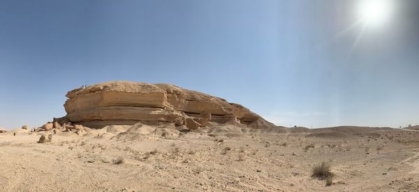 Rock formations in desert against sky