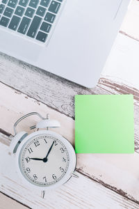 High angle view of clock on table