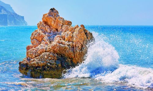 Blue splashing waves near birthplace of aphrodite in sunny cyprus