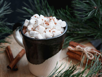 Close-up of marshmallows in mug on table