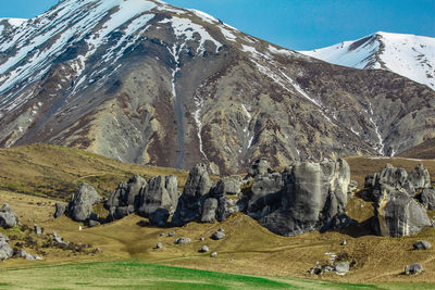 View of landscape with mountain range in background