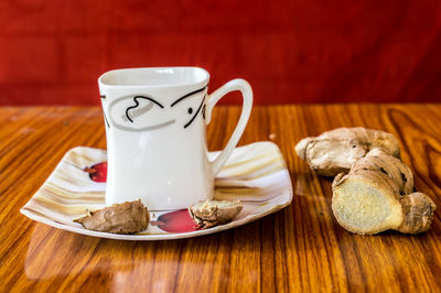 Close-up of coffee cup on table