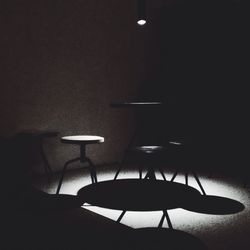 Chairs and table in illuminated room