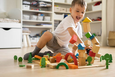 Boy playing with toy blocks at gym