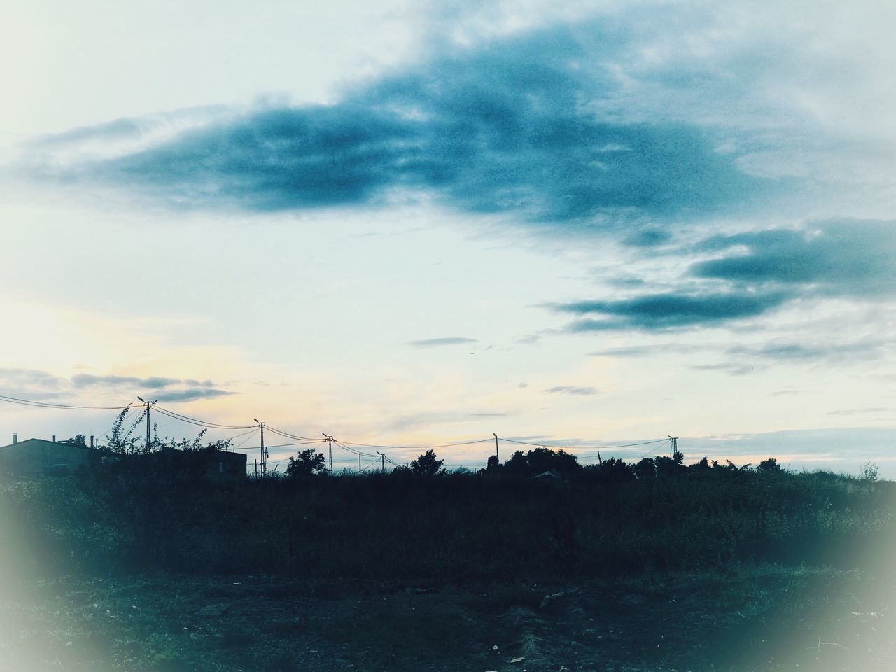 SILHOUETTE OF SEA AGAINST SKY DURING SUNSET