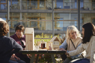 Neighbors making bug hotels together