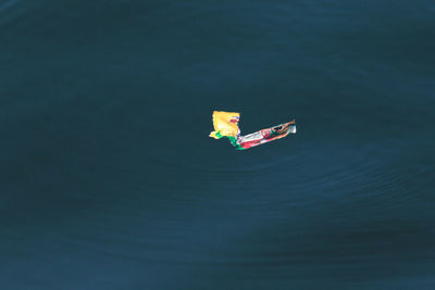 High angle view of toy floating on sea