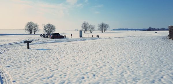 Scenic view of snow covered landscape against sky