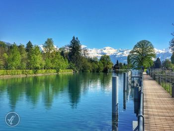 Scenic view of lake against blue sky