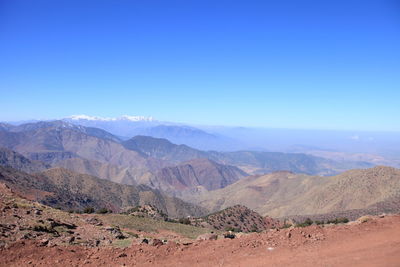 Landscape with mountain range in background