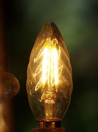 Close-up of illuminated light bulb