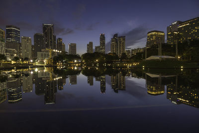 Reflection of city in water at night