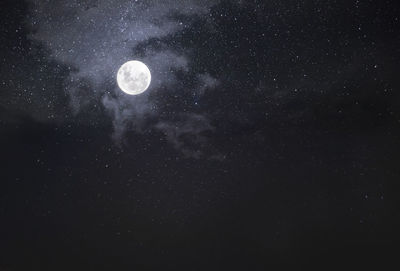 Low angle view of moon against sky at night