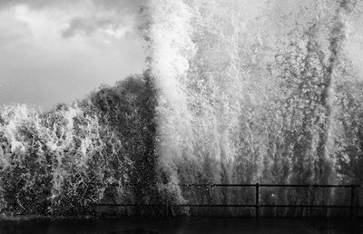 Close-up of splashing water against trees